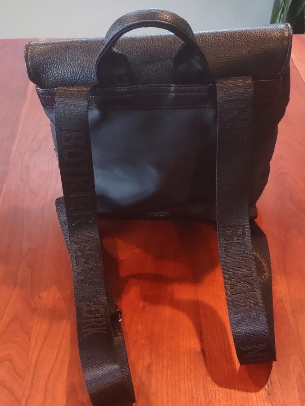 Botkier Black Backpack with Textured Flap, Adjustable Straps And Zip Pockets